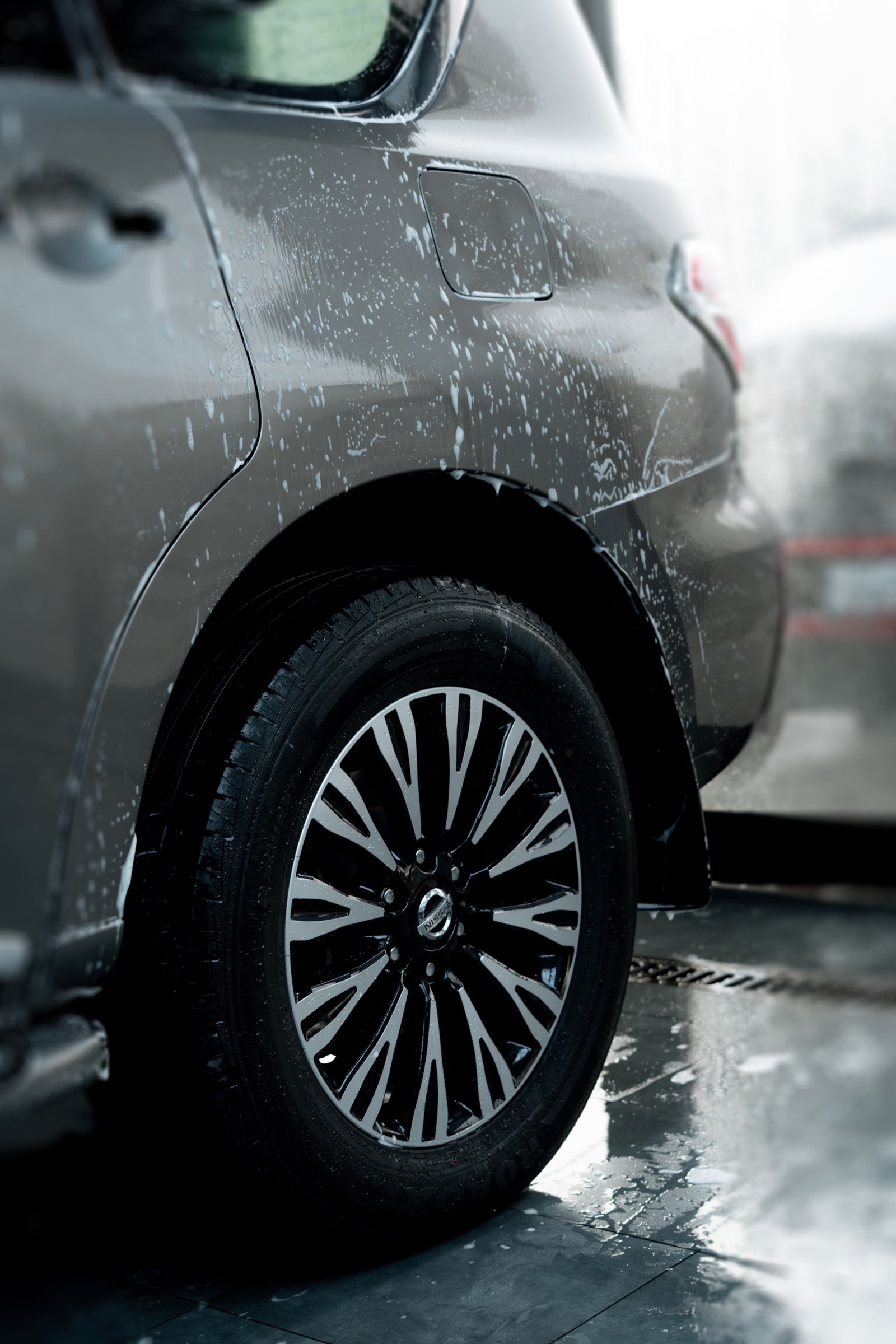 Close view of a wheel being carefully washed